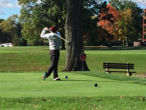John Burns, a senior on the team, on his first tee of the day at the State Tournament.