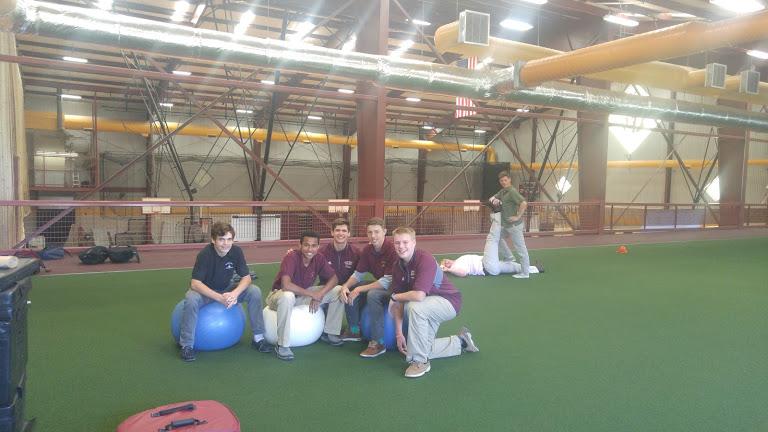 WJ athletes pose in the new turf training area located in the mezzanine of Rico Fieldhouse. 