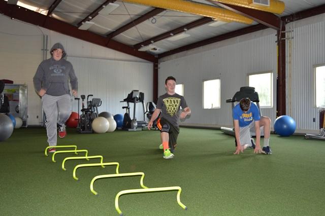 Members of the WJ sophomore class use the new turf area in the mezzanine of the Rico Fieldhouse. 