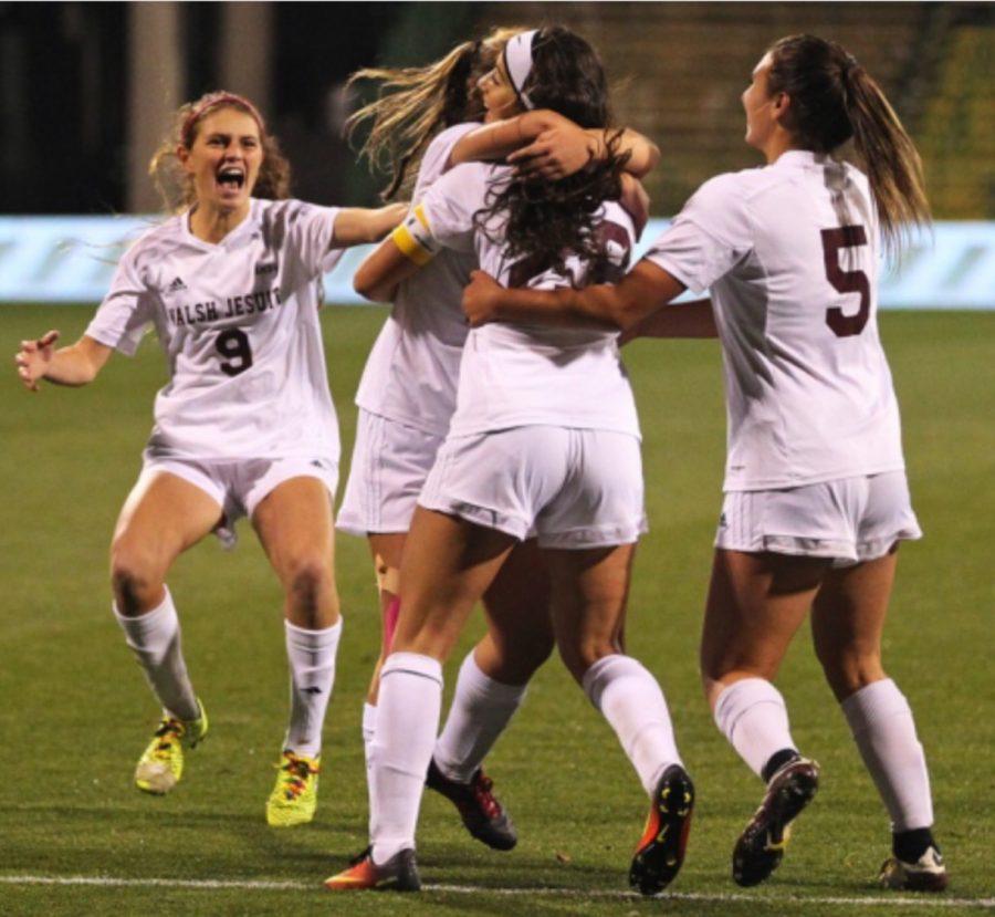 Walsh Jesuit womens soccer team celebrates after senior Sofia Rossi scores.
