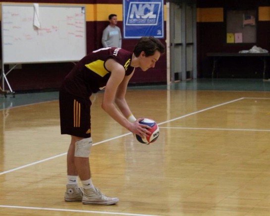 Junior Eric Bulgrin prepares to serve the ball in a game against St. V. 