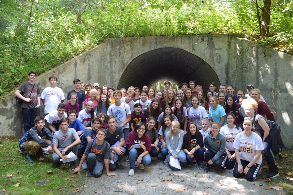 The group poses for a photo near a CVNP Railway tunnel.  The day left many feeling closer to God and classmates. Several also shared that the experience made them want to do more. Freshmen retreatant Benjamin Foltz shared, After this retreat, I feel more compelled to get involved [with Campus Ministry].”
