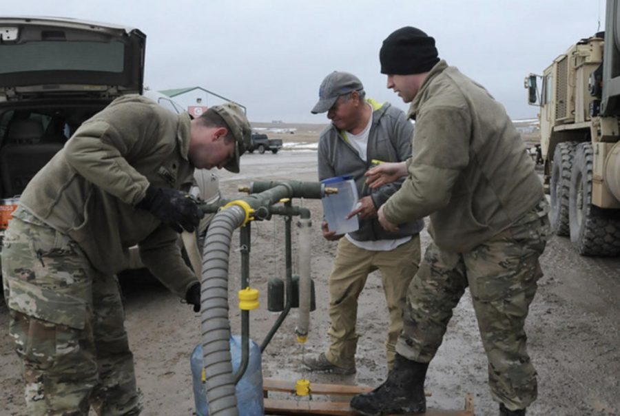The South Dakota National Guard attempt to restore drinking water to an area of the reservation on March 25. The main waterline failed after the floods arrived.