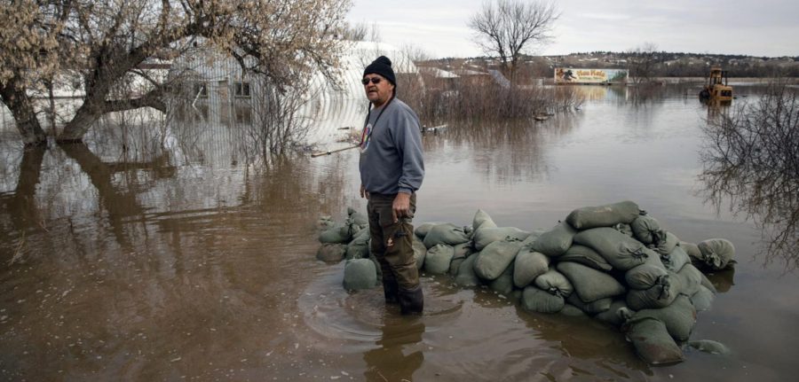 At Pine Ridge Indian Reservation, S.D., Henry Red Cloud surveys the damage done by the spring 2019 flooding. 