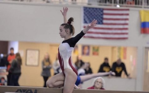 Sophomore Leah Sherman competes on the balance beam during a recent competition at First Flips Gymnastics in Solon. 