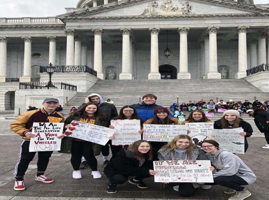 The Walsh Jesuit group attending the march, in front of the Capital Building in Washington D.C
Right to left front to back: Emily Girard, Maria Poppenhouse, Madison Robusto, Emily Polatajko, Sarah Elbin, Kaitlyn Lou, Jacquelyn Elbin, Mary Snock, Tyler Capron, Connor Bailey. Not pictured Tim Dunn, Director of Campus Ministry.
