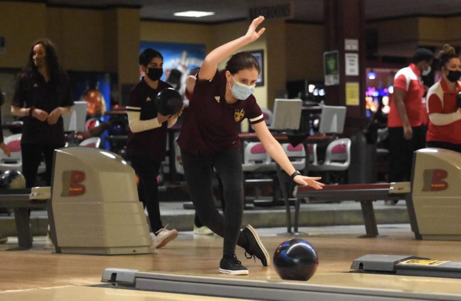 Junior Emily Wilson displays perfect form in the match against Akron East.