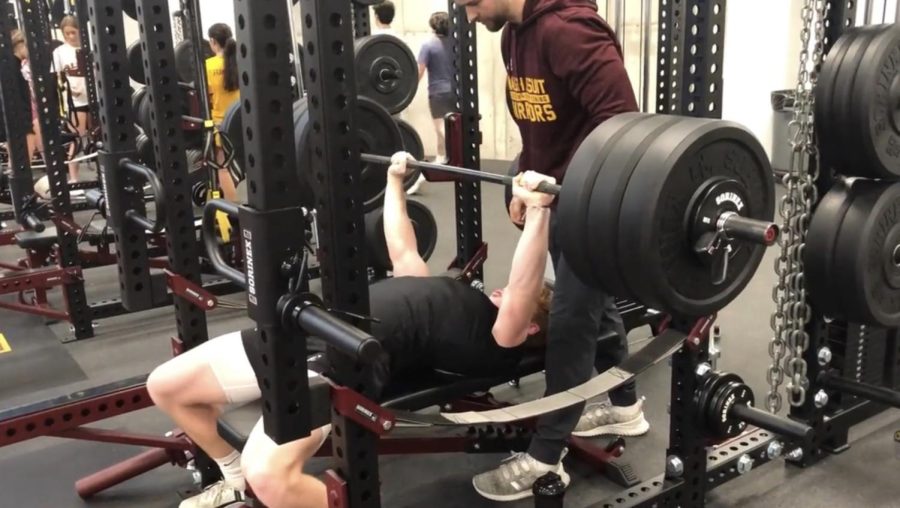 Senior Mason Bailey, using the  new Sorinex weight lifting equipment. Bench pressing 325lbs.