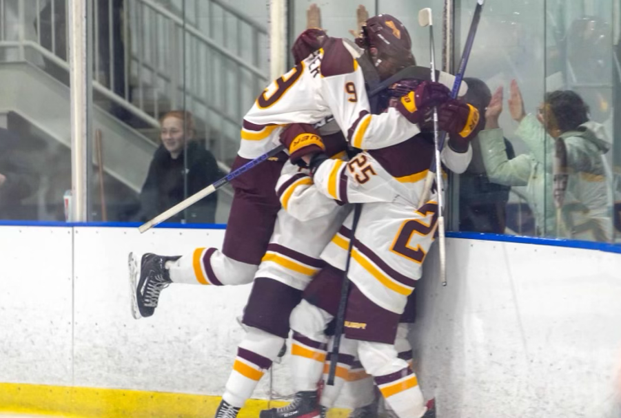 Celebration after senior Patrick McCarthy’s overtime winning goal, as picture left to right senior Ryan Kerscher and senior Josh Weiner. 