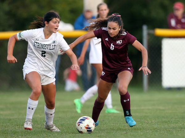 Senior Francesca Villa takes the ball downfield during this game against Strongsville. 